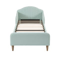 Lit moderne en tissu vert avec sommier à lattes